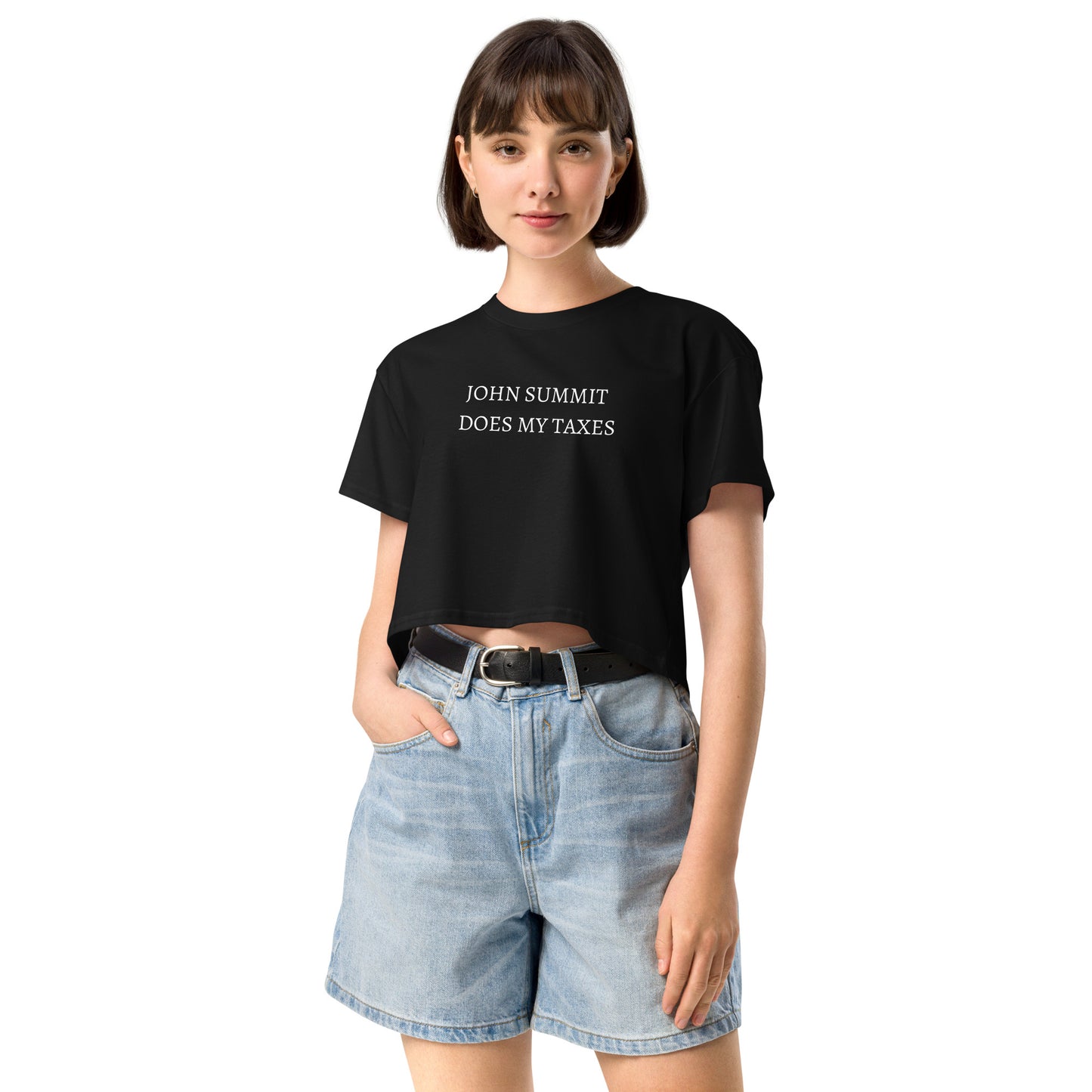 Model wearing Black cropped t-shirt with white text that says “John Summit does my taxes,” funny EDM rave crop top for music festivals.