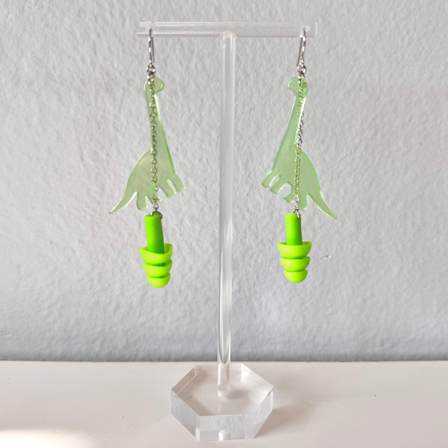Dinosaur (Long Neck) Earplug Earrings Earrings from Rave Day. Perfect gift for ravers, music lovers, and anyone in need of hearing protection at loud events!