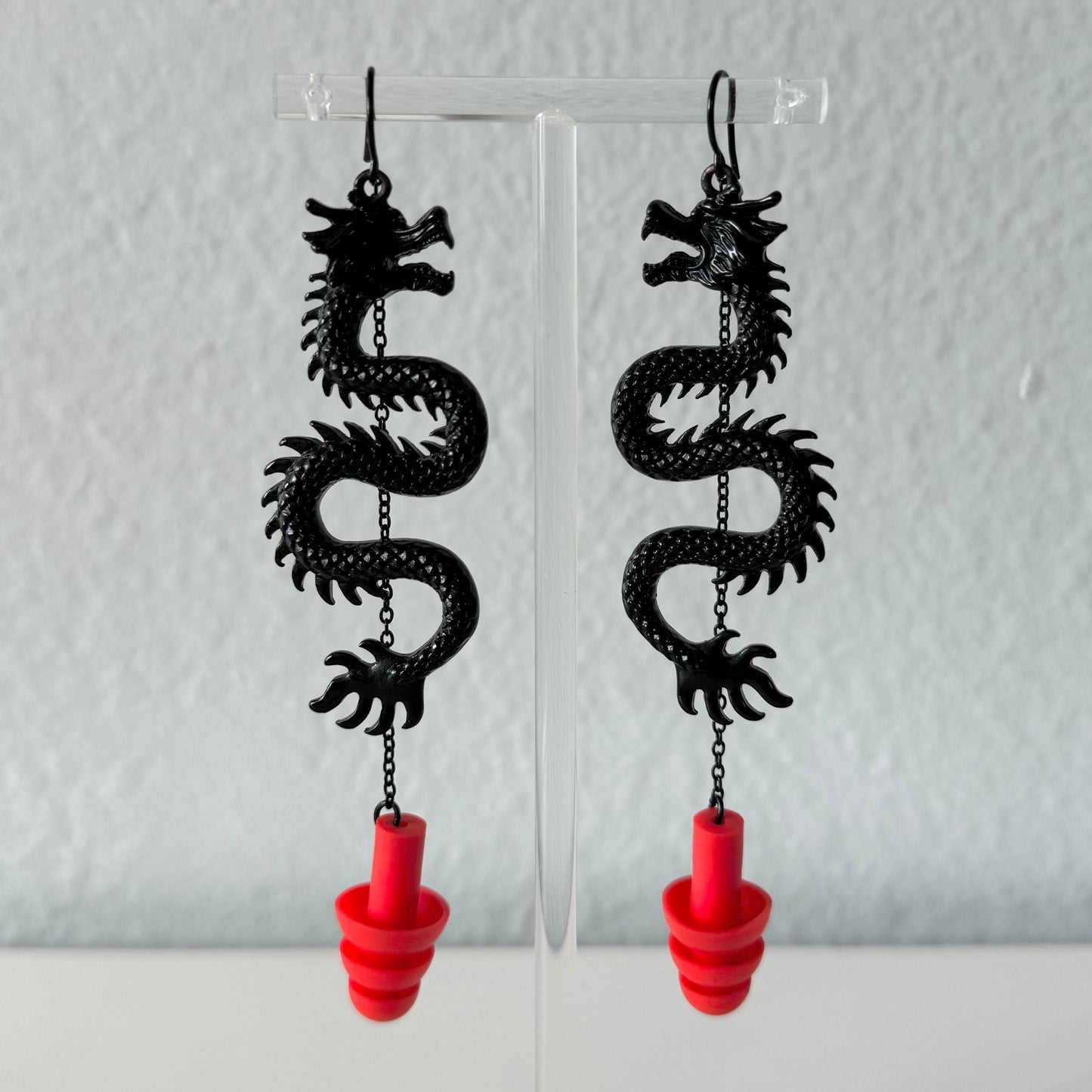 Black Dragons earplug earrings, zoomed in view of ear plugs