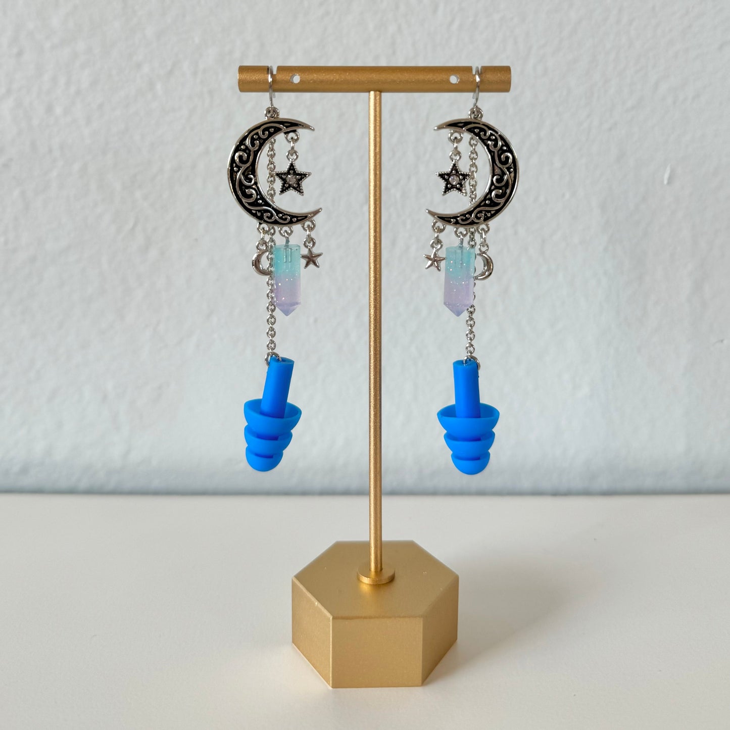 Sparkling blue and purple Midnight Moon Earplug Earrings with royal blue ear plugs attached. Stylish ear plugs for ravers.